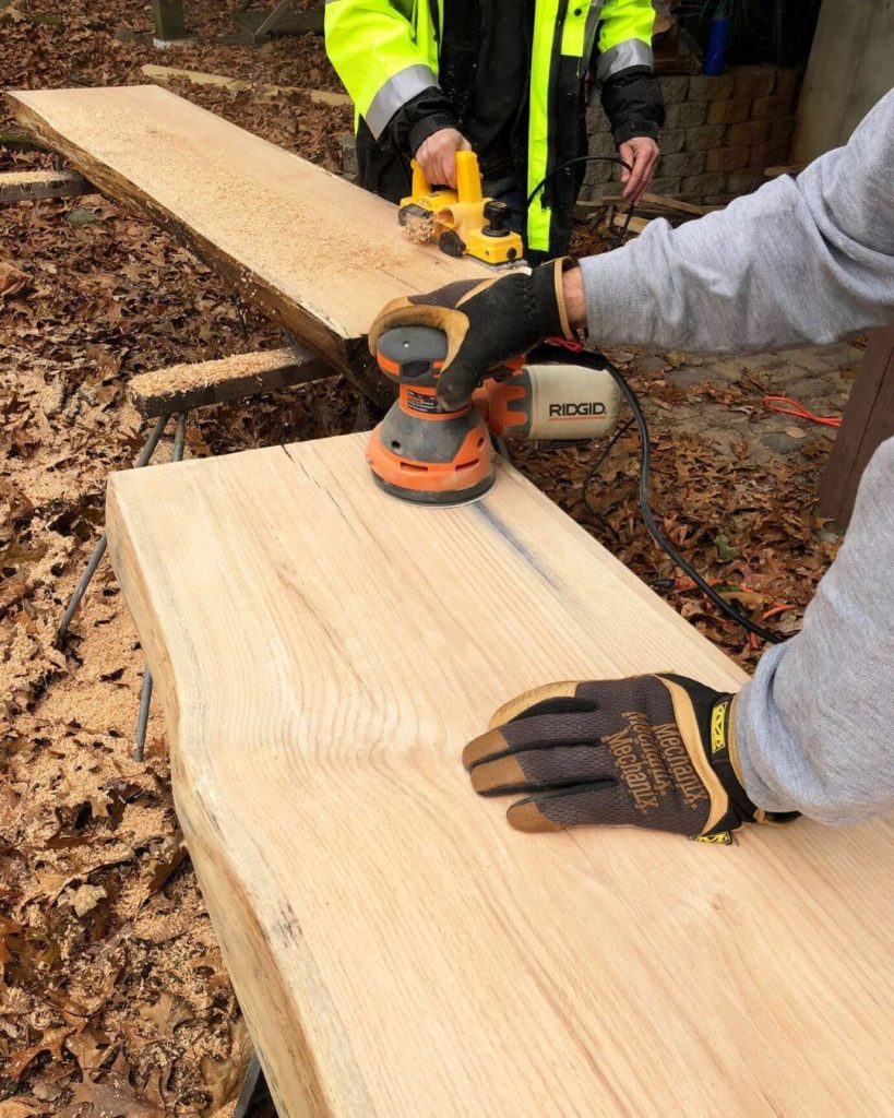 Sanding down bar and table tops for Chicago taproom