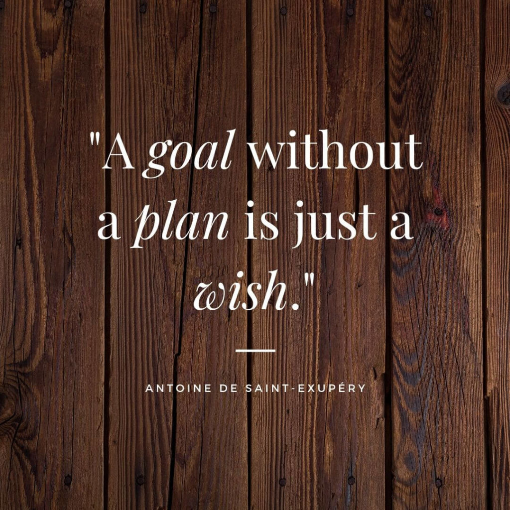 Antoine de Saint-Exupéry quote on wood background, A goal without a plan is just a wish.