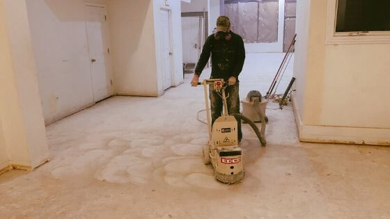 Man in mask buffs floors of future Northside Chicago taproom