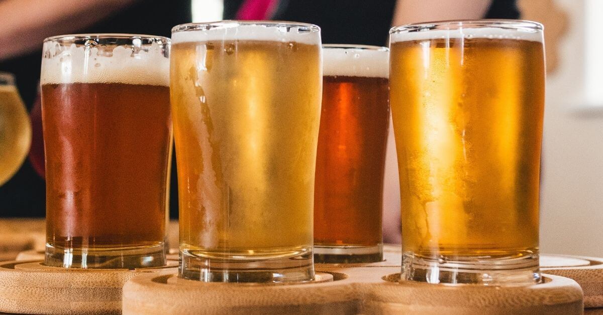 Four beers in beer glasses